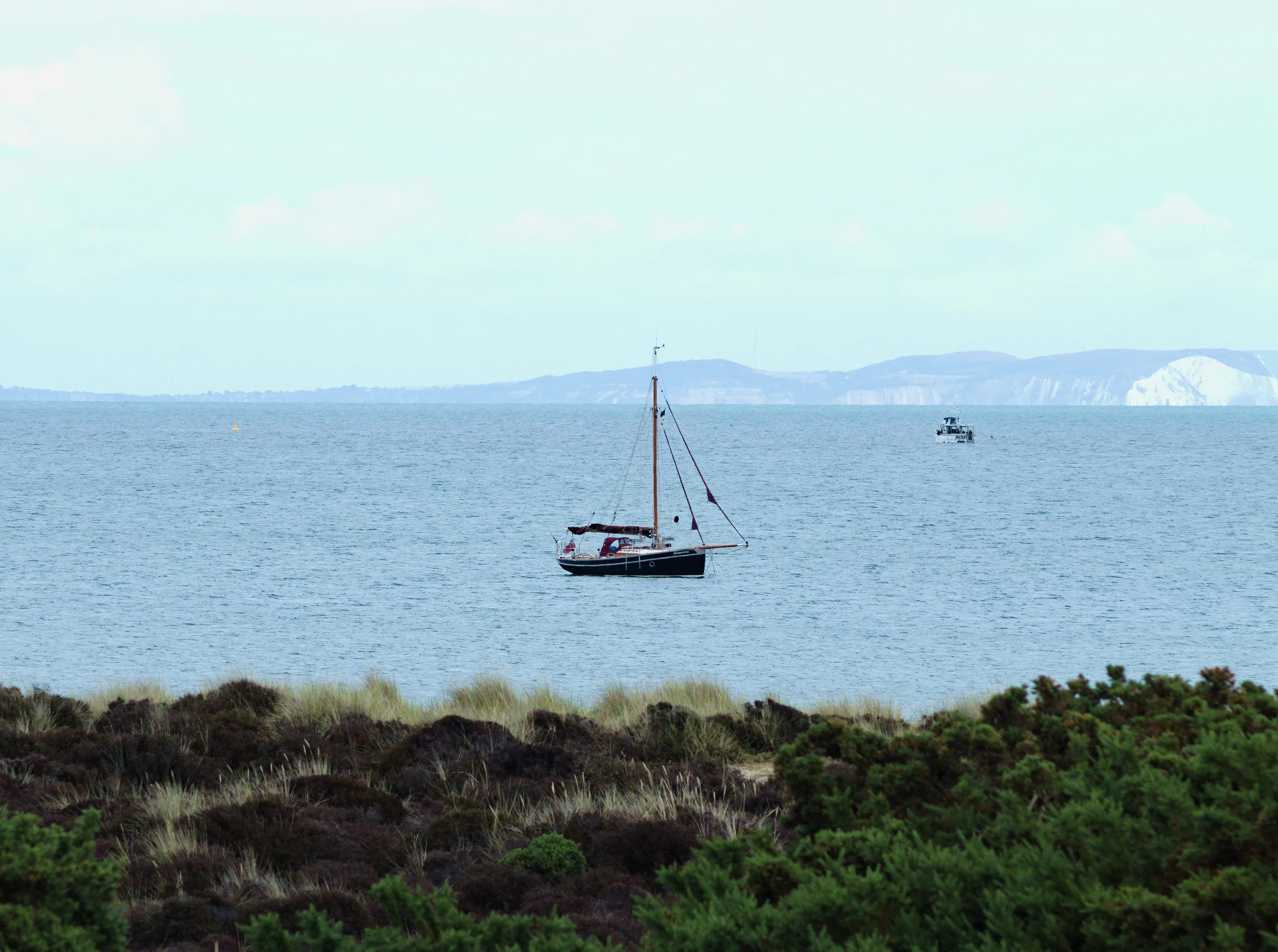 old silboat just off the coast