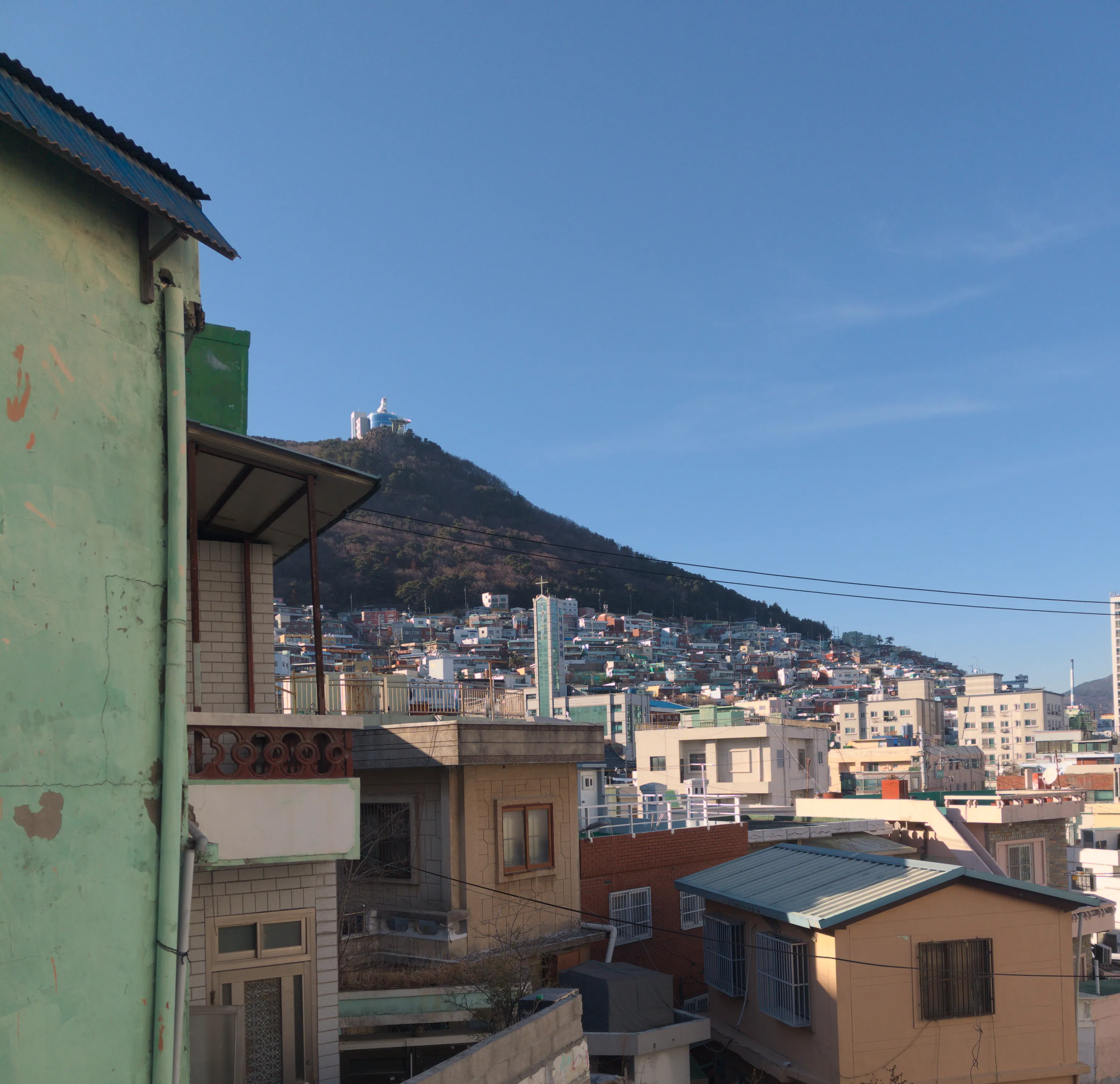 a shot of the old houses on a hill in busan